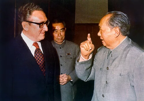 More details Kissinger, shown here with Zhou Enlai and Mao Zedong, negotiated rapprochement with China.